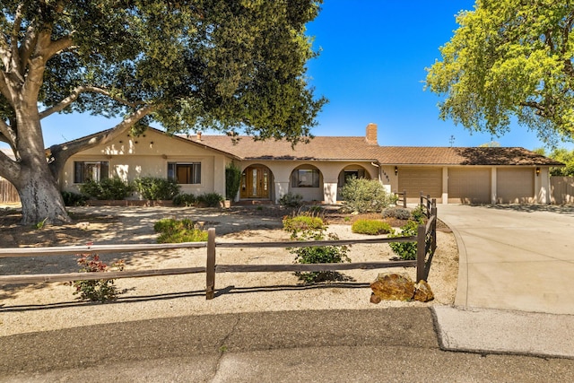 ranch-style house featuring a garage