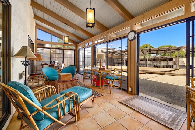 sunroom / solarium with vaulted ceiling with beams