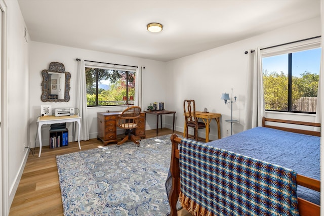 bedroom with light hardwood / wood-style flooring