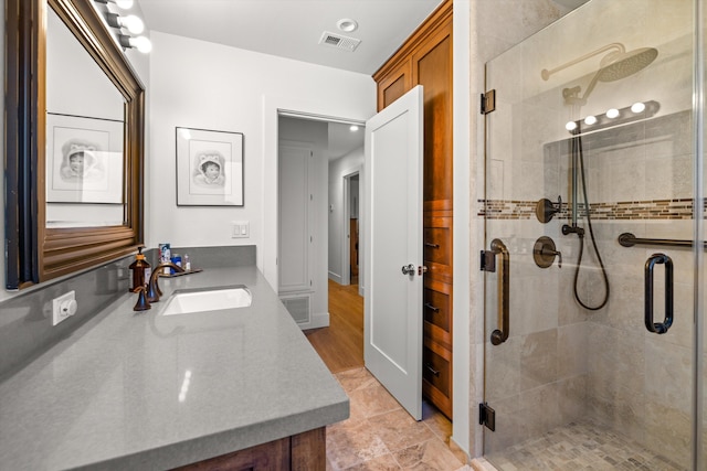 bathroom with vanity and walk in shower