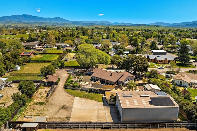 birds eye view of property featuring a mountain view