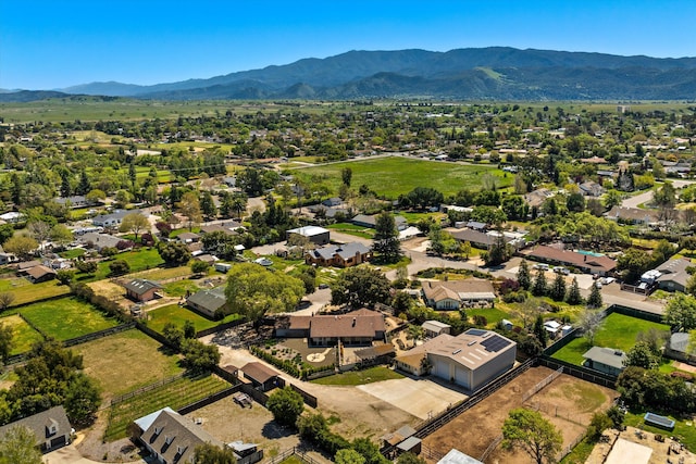 birds eye view of property featuring a mountain view