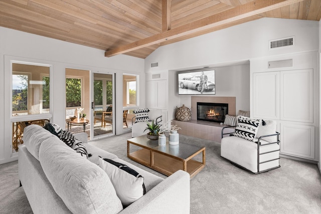 carpeted living room with wood ceiling, a fireplace, and beam ceiling