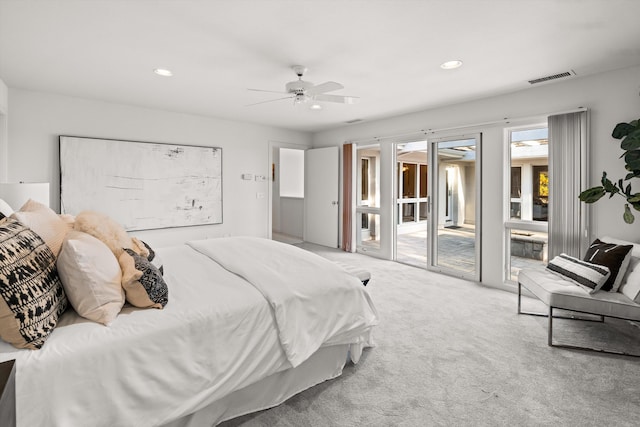 carpeted bedroom with ceiling fan and access to outside