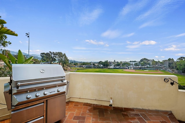 view of patio / terrace featuring area for grilling and a grill