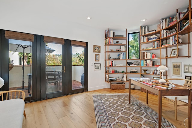 office space with light wood-type flooring