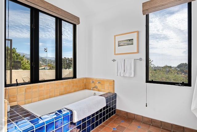 bathroom featuring tile patterned floors and a wealth of natural light