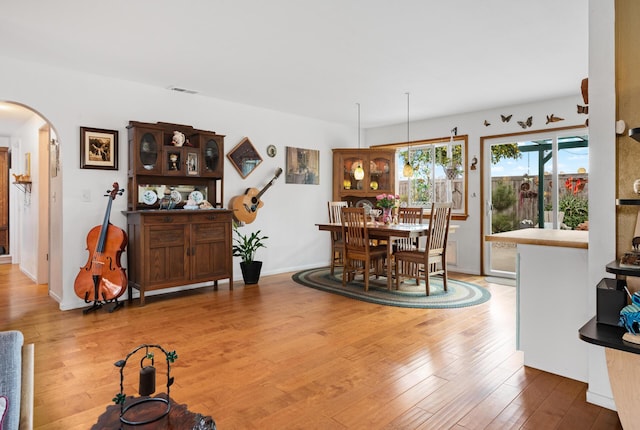 dining space featuring wood-type flooring