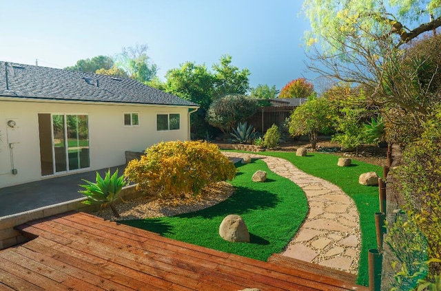 view of yard featuring a wooden deck