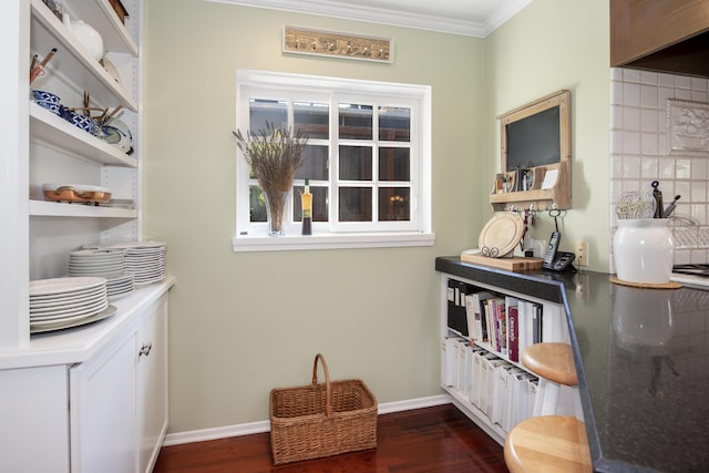 interior space featuring crown molding, decorative backsplash, and wood-type flooring