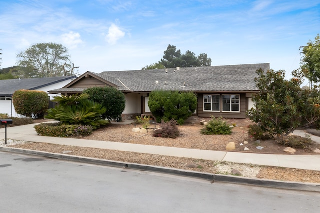 ranch-style home featuring a garage