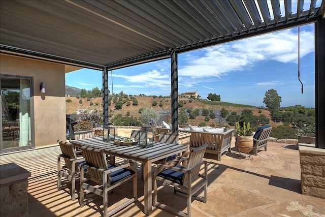 view of patio / terrace with an outdoor hangout area and a rural view