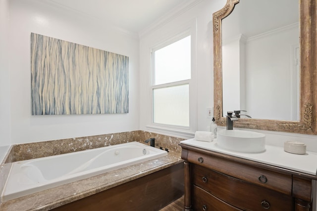 bathroom with ornamental molding, a bath, and vanity