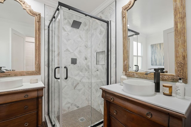 bathroom with a shower with door, vanity, and ornamental molding