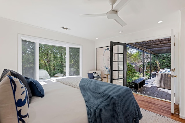 bedroom with ceiling fan, access to exterior, and hardwood / wood-style floors