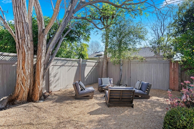 view of yard featuring an outdoor living space with a fire pit