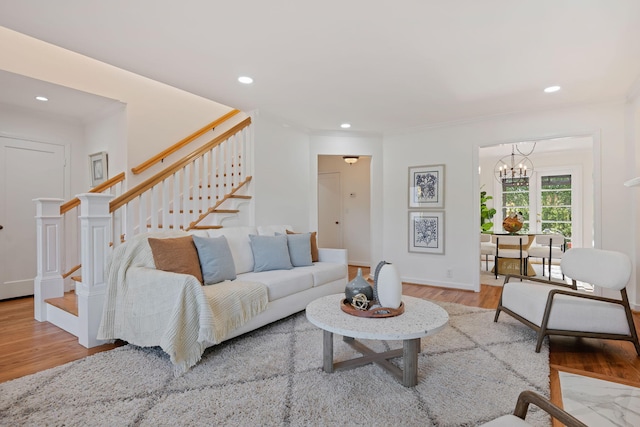 living room with wood-type flooring and a chandelier