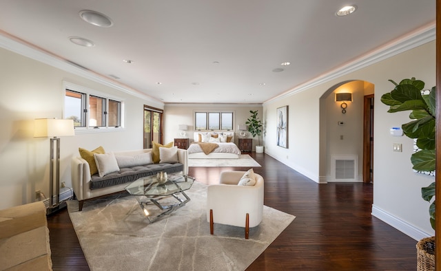 living room with ornamental molding and dark hardwood / wood-style floors