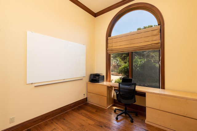 home office with dark wood-type flooring and ornamental molding