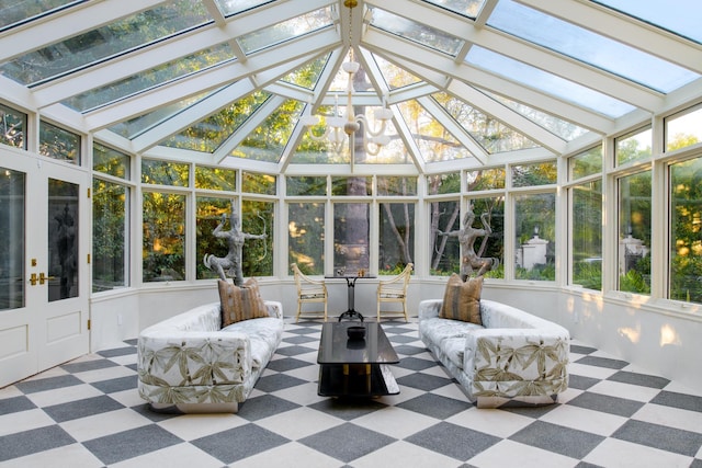 sunroom featuring lofted ceiling with skylight