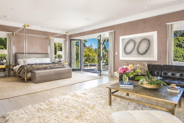 bedroom with access to exterior, hardwood / wood-style flooring, and ornamental molding