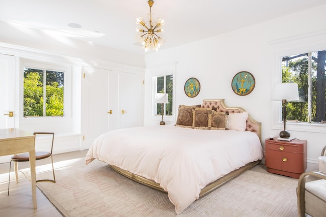 bedroom featuring an inviting chandelier