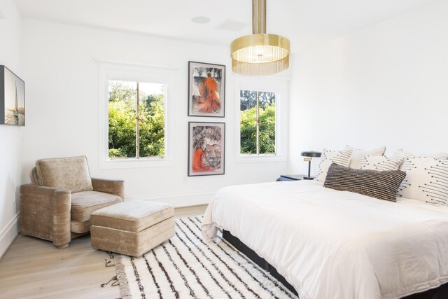 bedroom with light wood-type flooring