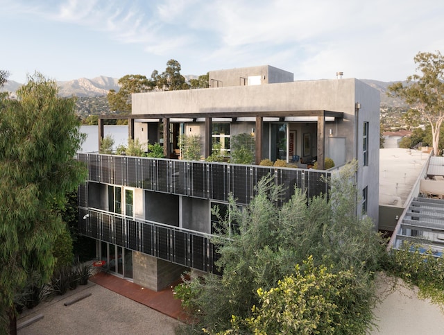 back of property with a mountain view