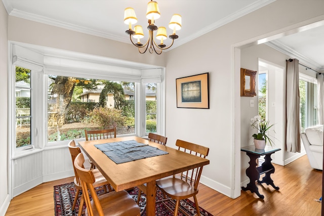 dining space featuring ornamental molding and a healthy amount of sunlight