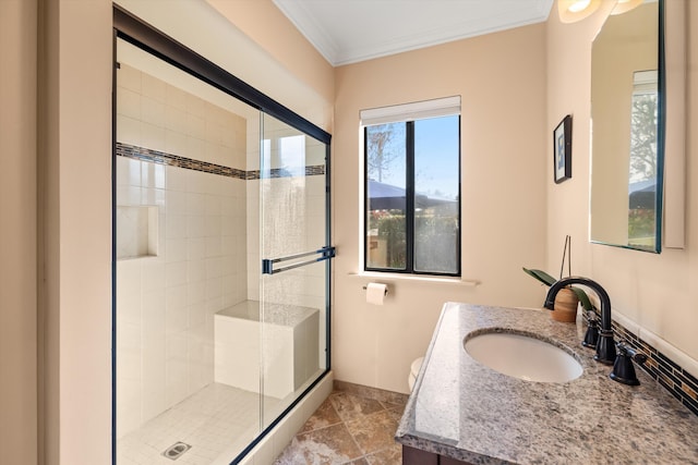 bathroom featuring ornamental molding, toilet, an enclosed shower, and vanity