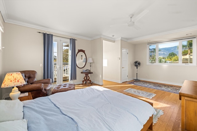 bedroom featuring ornamental molding, access to exterior, ceiling fan, and light hardwood / wood-style flooring