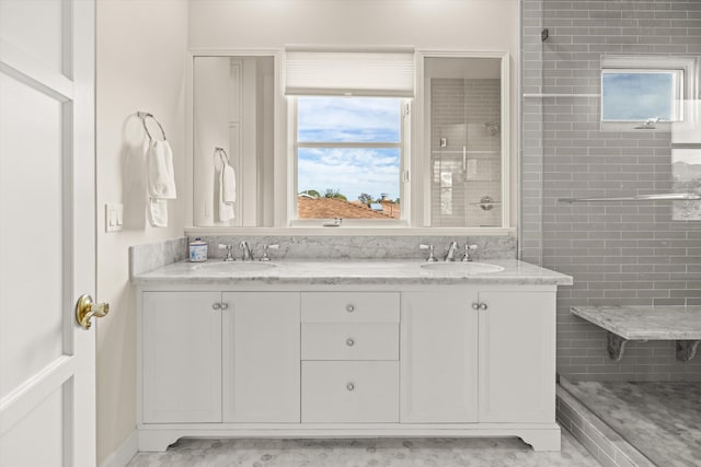 bathroom featuring vanity and a shower