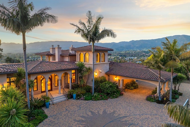 mediterranean / spanish house featuring a mountain view and a porch