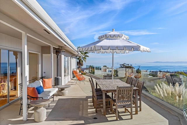 view of patio with a water view