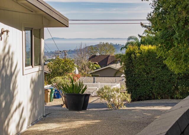 view of yard with fence and a mountain view