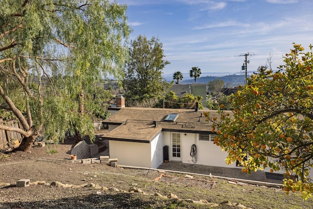 view of front facade with a patio area and stucco siding