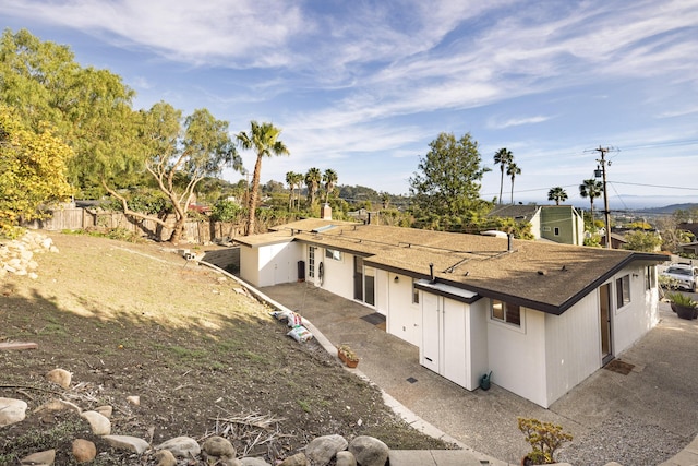 exterior space featuring a patio area and fence