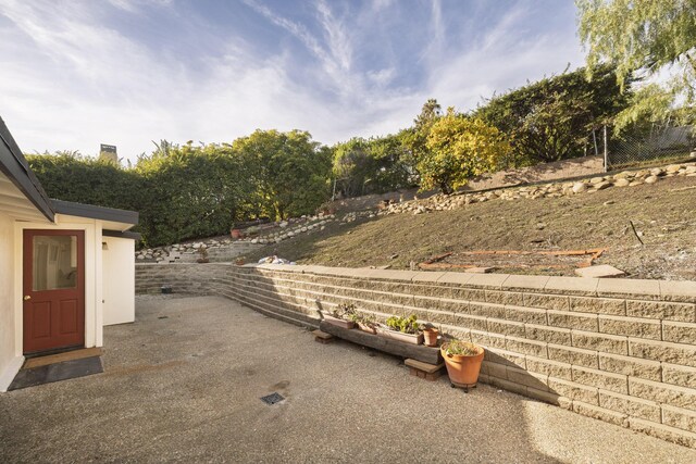 view of yard featuring a patio area and fence