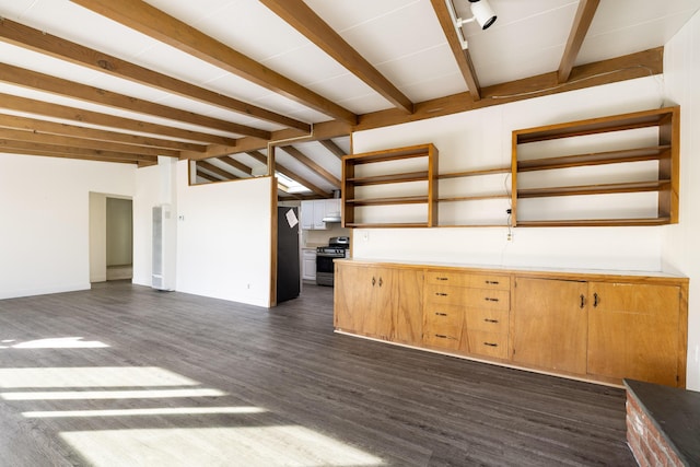 kitchen with lofted ceiling with beams, appliances with stainless steel finishes, dark wood-type flooring, light countertops, and open shelves