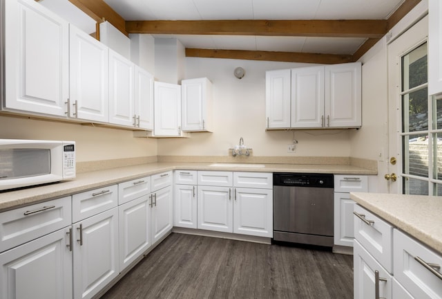 kitchen with white microwave, a sink, white cabinetry, light countertops, and dishwasher