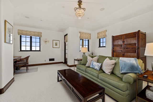 4230 Cresta Ave, Santa Barbara, CA 93110 - carpeted living room featuring an inviting chandelier and plenty of natural light