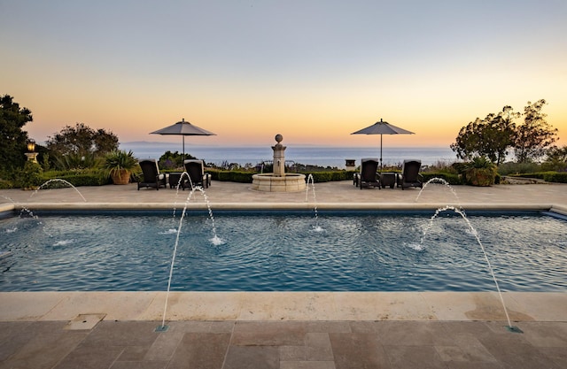 4230 Cresta Ave, Santa Barbara, CA 93110 - pool at dusk featuring pool water feature, a water view, and a patio