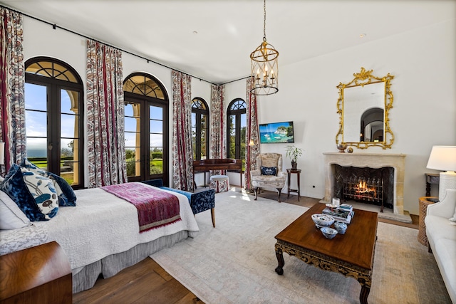 4230 Cresta Ave, Santa Barbara, CA 93110 - bedroom with hardwood / wood-style floors, a notable chandelier, and french doors