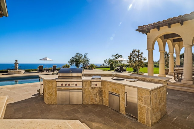 4230 Cresta Ave, Santa Barbara, CA 93110 - view of patio with a water view, a grill, and exterior kitchen