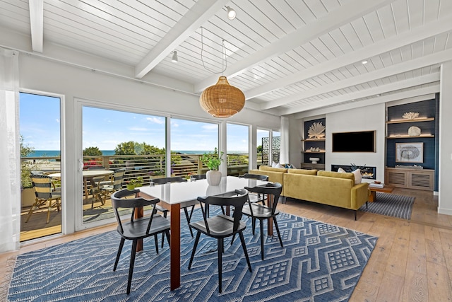 sunroom / solarium with lofted ceiling with beams and wood ceiling