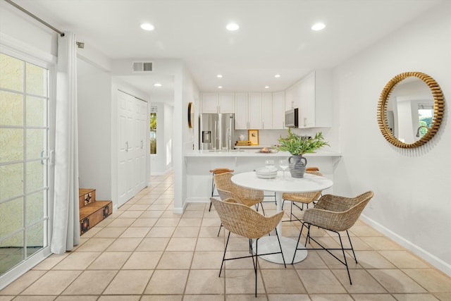 dining area with recessed lighting, visible vents, baseboards, and light tile patterned floors