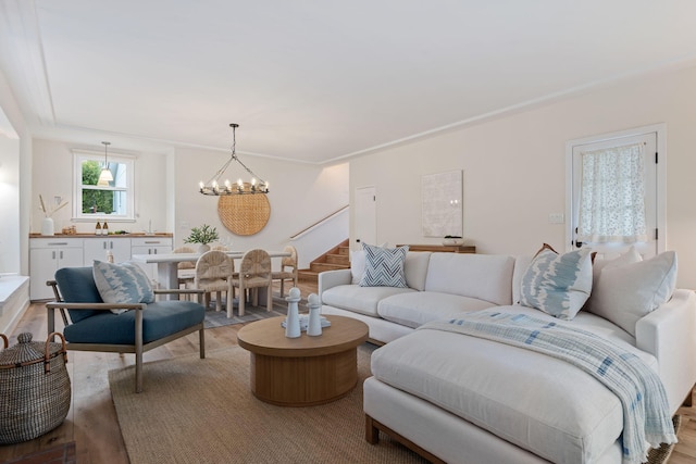 living room featuring an inviting chandelier and light hardwood / wood-style floors