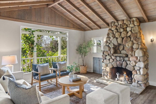 living room featuring hardwood / wood-style flooring, a fireplace, lofted ceiling with beams, and wooden ceiling