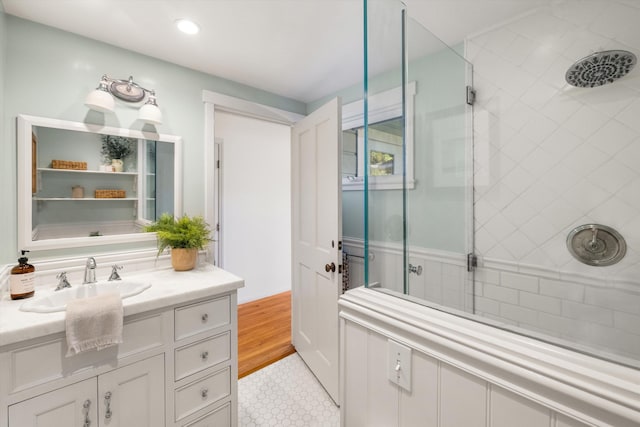 bathroom featuring vanity and a tile shower