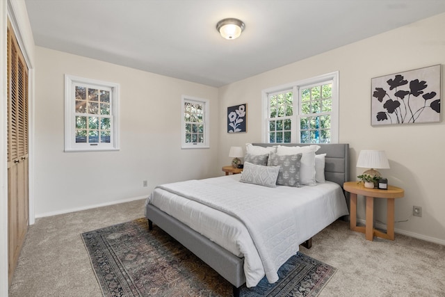 carpeted bedroom with a closet